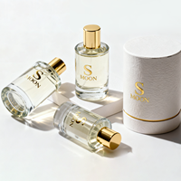 Flacon de parfum cylindrique en verre de luxe 30 ml 50 ml 100 ml, base épaisse avec bouchon noir, emballage écologique, flacon de parfum vide
