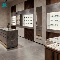 Comptoir de présentation personnalisé pour magasin d'optique avec éclairage LED pour la décoration intérieure de magasin de lunettes