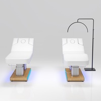 Table de massage électrique à 4 moteurs avec éclairage LED, colonne en acier inoxydable et base en bois, pour salon de tatouage et spa – Vente en gros usine