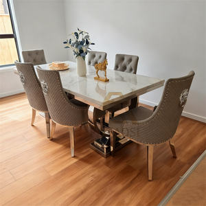 طاولة طعام فاخرة بتصميم عصري راقٍ على الطراز الاسكندنافي، قاعدة من الفولاذ المقاوم للصدأ الذهبي وسطح من الرخام الأسود، مناسبة للفلل والمطاعم - Product Image 2