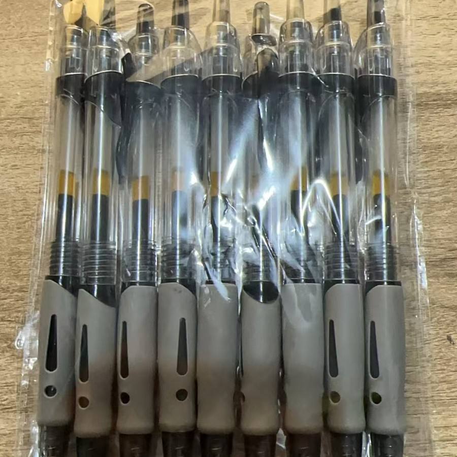 12 black click pens