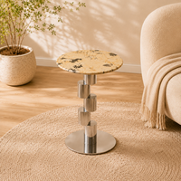 Table basse ronde moderne en marbre écologique de luxe avec base en colonne métallique pour salon et hôtel