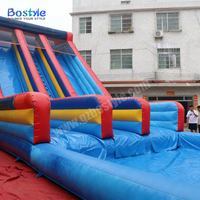 Toboggan aquatique gonflable commercial robuste à double piste avec grande piscine pour location en parc aquatique ou complexe hôtelier