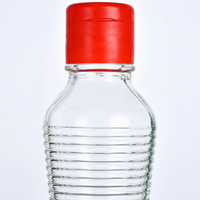 Bouteille en verre transparent pour huile et vinaigre avec bouchon métallique hermétique, idéale pour les assaisonnements et sauces de cuisine (vente en gros)