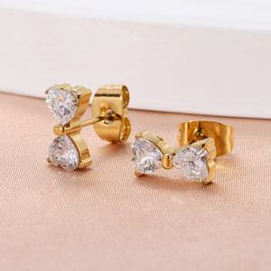 Boucles d'oreilles tendance en acier titane avec nœud étoile et zircon, forme fleur, style luxe léger et simple, pour soirée, vente en gros - Product Image 1