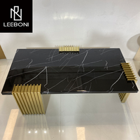 Table basse italienne de luxe en marbre noir avec pied moderne Tables basses de luxe en pierre de granit naturel doré