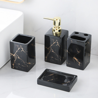 Elégant ensemble d'accessoires de salle de bain en marbre noir pour hôtel ou maison distributeur de savon en céramique porte-brosse à dents et plateau
