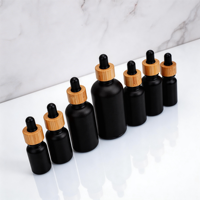 Flacons compte-gouttes en verre noir premium 15ml 30ml 50ml 100ml avec bouchons en bambou pour huiles essentielles