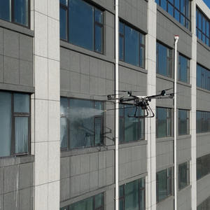 Nouveau drone de nettoyage HXC pour murs-rideaux en verre de grande hauteur, stabilité à 6 axes, étanche IP67, nettoyage haute pression pour gratte-ciel - Product Image 1