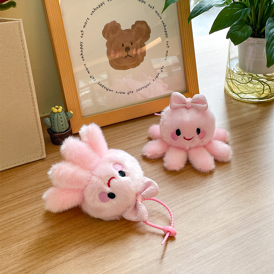 チャーミングで心地よいピンクのタコのぬいぐるみは、お子様の喜びと
