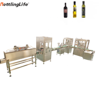 Machine de remplissage automatique de liquides (vinaigre et vin) à têtes multiples de type linéaire, 250 ml et 750 ml, avec pompe à piston