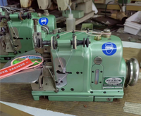 Surjeteuse industrielle d'occasion Merrow MG-3U pour la surjetage des bords de patchs, idéale pour la couture décorative sur les casquettes et les sacs à dos