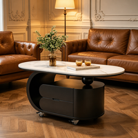 Table basse ovale moderne en marbre avec tiroirs de rangement et roulettes pour salon