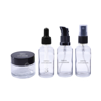 Kosmetik-Set Glasverpackung: Tropfflasche, Lotionspumpflasche, Sprühflasche & Cremedose, Oberfläche mit Goldprägung