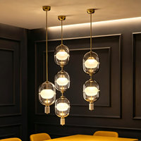 Luminaire suspendu en verre de style nordique créatif pour café, restaurant, hall d'accueil, salle d'exposition, escalier, lustre pour plafond haut