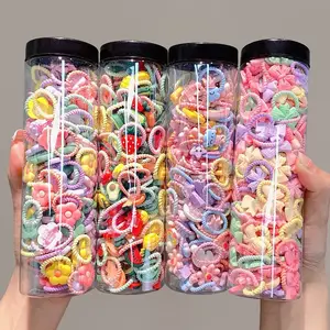 40 Uds 2024 niños calientes lindo Color caramelo pequeño Mini pulgar lazos para el cabello conjunto encantadoras bandas de goma de dibujos animados niñas accesorios para el cabello de bebé