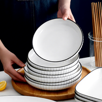 Ensemble de bols et d'assiettes en céramique et porcelaine, sans BPA, écologiques, résistants à la chaleur, durables, étanches, blancs avec bord noir, pour hôtel, restaurant, salle à manger