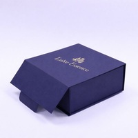 Boîte rigide en forme de livre avec fermeture magnétique bleu marine de luxe personnalisée avec du papier de soie pour l'emballage de cosmétiques haut de gamme