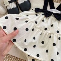 Nouvelle combinaison d'été pour bébé, barboteuse sans manches à pois avec nœud, robe douce pour nouveau-né, vêtements pour bébé fille
