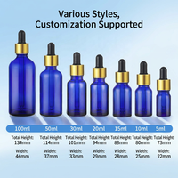 Bouteilles d'huile essentielle en verre ambré cylindriques bleues brillantes avec bouchon à vis en aluminium doré et compte-gouttes, sérum de haute qualité 10ml 30ml 50ml 100ml