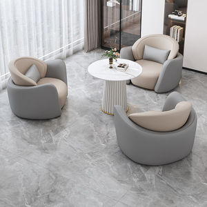 Ensemble de canapés de réception ronds en cuir, style minimaliste moderne, avec une table et quatre chaises rembourrées en éponge, pour usage commercial et de bureau - Product Image 3
