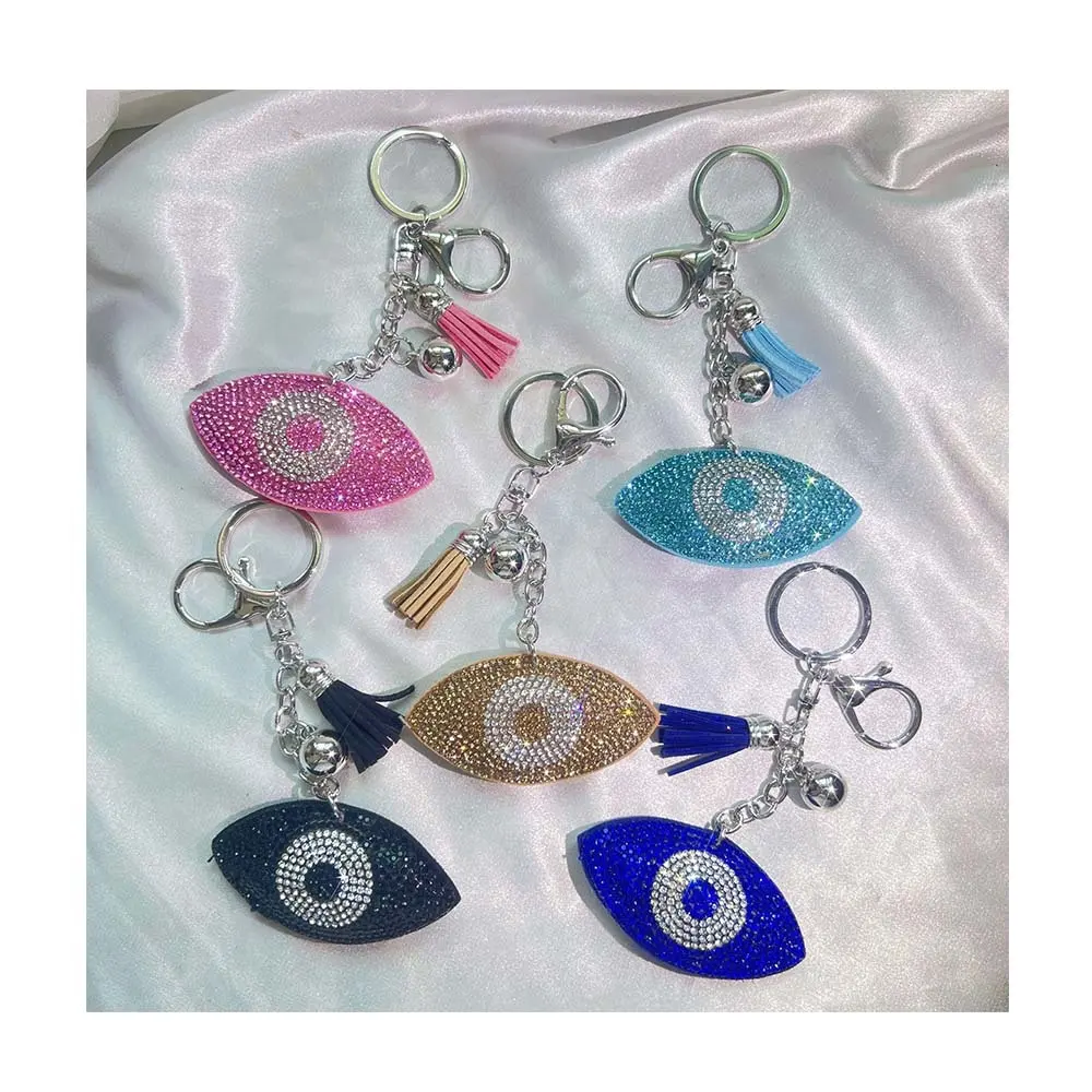 Vente en gros de sac de voiture pendentif accessoires pompon en cuir plaqué argent bleu cristal forme d'oeil porte-clés strass mauvais yeux porte-clés