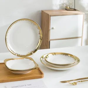 Vaisselle ronde en céramique OEM de l'usine Assiettes à dessert Assiette en porcelaine dorée pour hôtel de mariage