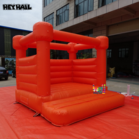 Château gonflable orange vif en PVC commercial durable, idéal pour toutes sortes de fêtes et d'événements
