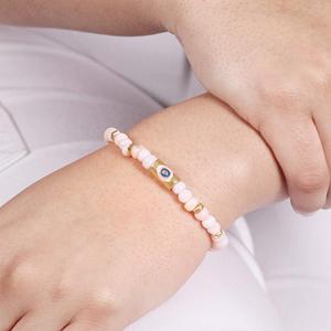 Bracelet extensible en opale rose avec breloque œil porte-bonheur et émail rose et bleu, en argent, de la marque Silver Export House - Product Image 1