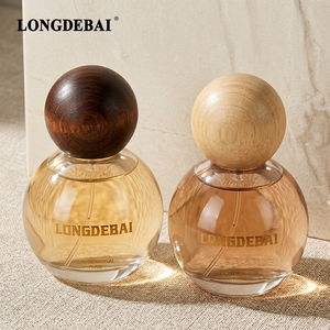 Aesthetic Custom Crimp Transparent Round <b>Perfume</b> Glass <b>Bottle</b> <b>30ml</b> 50ml 100ml Empty Clear <b>Perfume</b> <b>Bottle</b> with Round Wooden Cap - Product Image 1