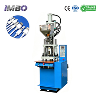 Machine de moulage par injection verticale robuste 35T pour la fabrication de fiches de câbles d'alimentation, adaptateurs CC, connecteurs et moules d'injection PVC
