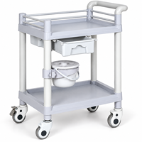 Chariot médical ABS à deux niveaux pour salle d'opération avec un seul tiroir et des barrières de sécurité pour la manipulation des instruments et le soutien clinique
