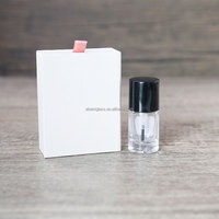 Bouteille d'huile pour cuticules de forme ronde transparente personnalisée de 15ml bouteille vide de vernis à ongles pour huile pour cuticules avec capuchon noir et brosse