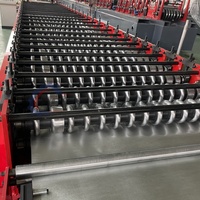 Máquina formadora de rollos de panel de pared y hoja de techo de hierro corrugado Dongguang Boshiyi 850 con componentes de núcleo de Motor de rodamiento de engranajes