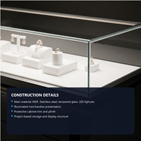 Comptoir de présentation de bijoux de luxe moderne avec éclairage LED, vitrine de vente au détail en verre noir sur mesure pour boutique de bijoux en centre commercial
