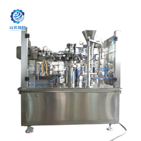 Machine d'emballage automatique de sachets préformés en acier inoxydable 304 de qualité alimentaire avec alimentation par sac pour bonbons et biscuits