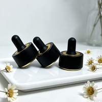 Système compte-gouttes en verre premium 30 ml avec capuchon noir mat et emballage carton pour crème visage et collyre