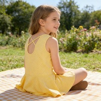 Robe sans manches pour petite fille en tissu confortable et doux pour la peau, motif à pois jaunes et blancs, tenue d'été pour les vacances, vente en gros personnalisée, livraison rapide