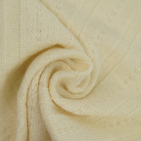 Tissu jacquard côtelé en TC Spandex 250 GSM durable, certifié GOTS GRS, respirant, tricot ajouré à œillets pour hauts de gamme