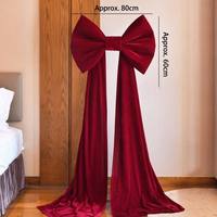 Ornements de nœuds surdimensionnés en velours doré pour la décoration de salles de mariage et les décors de vitrines de centres commerciaux