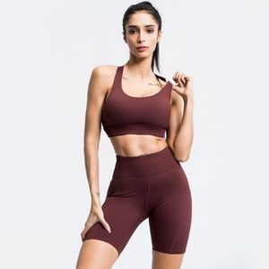 Ventas calientes Active Wear Gym Seamless Halter Backless Bra Shorts con bolsillo Se puede imprimir logo Mujeres Fitness Yoga Set para mujeres - Product Image 1