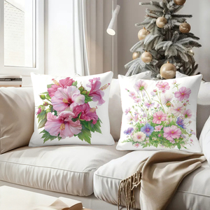 Floral throw pillows adorn cozy sofa with festive stockings and reindeer antlers in holiday decor scene - Product Image 4
