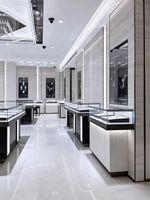 Vitrine d'îlot pour bijoux Arc Jewelry avec éclairage LED personnalisé, design épuré et durable respectueux de l'environnement pour les boutiques haut de gamme