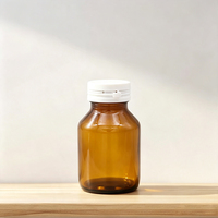Flacon en verre ambré avec bouchon à clapet inviolable, protection UV pour les compléments alimentaires en capsules