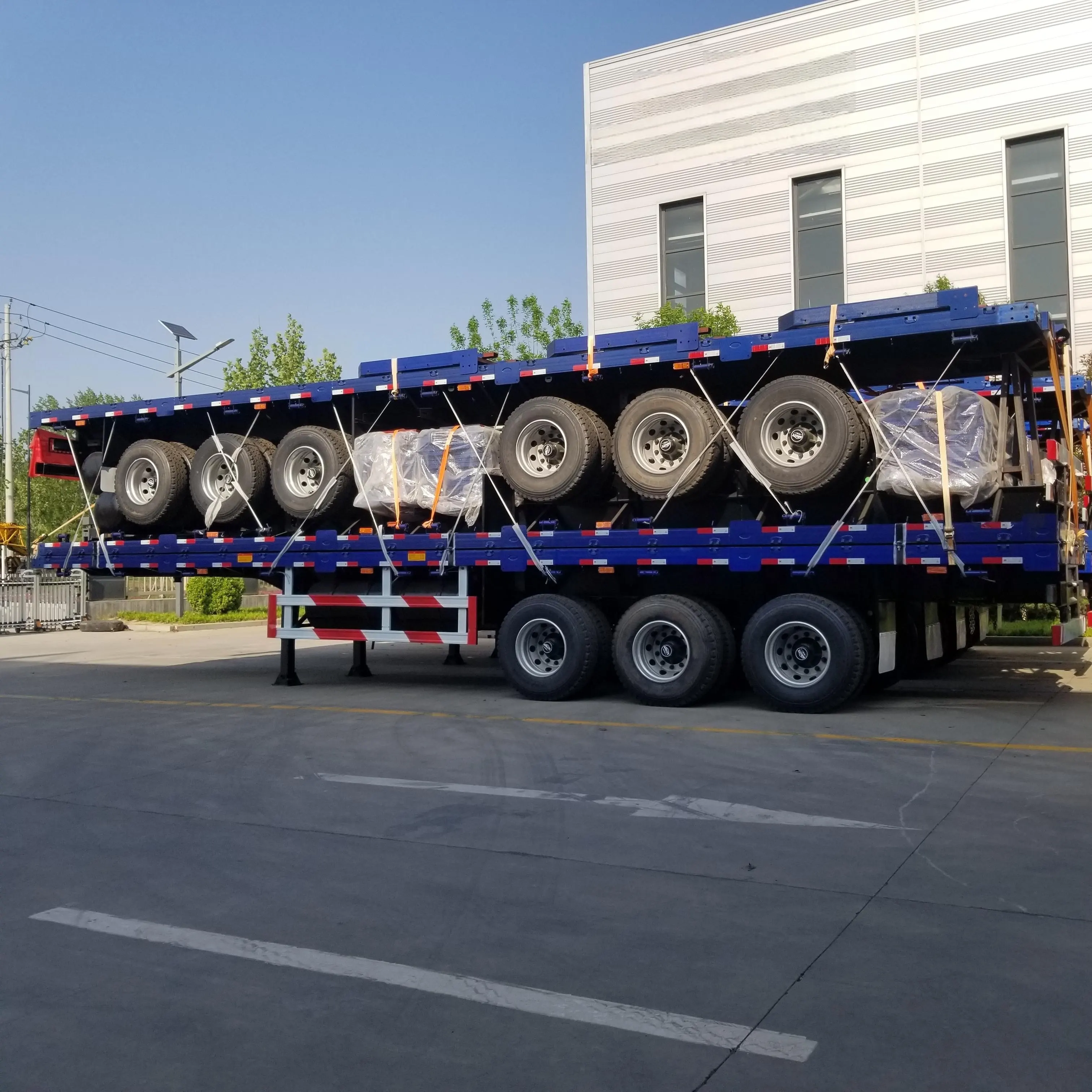 Jutong Fabriek Multi-Assen 60 Ton 40 Voet 12 Stuks Flatbed Aanhangwagens Hoofdeinde Container Vrachtwagens Oplegger Te Koop