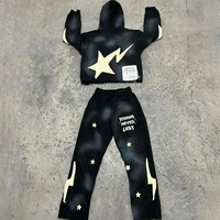 Ensemble de survêtement unisexe délavé à l'acide avec sweat à capuche zippé et pantalon évasé effet vieilli et patchs