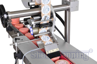 Machine d'étiquetage automatique pour bouteilles, système d'étiquetage pour ligne de production et d'emballage, étiquetage supérieur des produits