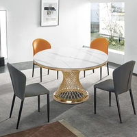 Table à manger ronde moderne de 51 "avec dessus en marbre et piédestal en acier inoxydable doré pour 6 places dans le salon salle à manger hôtel