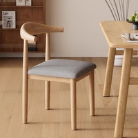 Chaise de salle à manger de style nordique et médiéval avec revêtement en cuir et coussin moelleux, modèle Horn Chair pour meubles de maison, pieds en métal