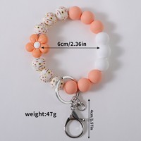 Niedliches Blumen-Silikon-Perlenarmband mit Blumendruck, elastisches Schlüsselband, Handtaschenanhänger, Damen-Taschenaccessoire